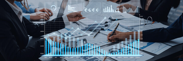 A group of business professionals collaborates on data analysis and financial planning, utilizing charts and graphs to visualize market trends and statistics. Scalp