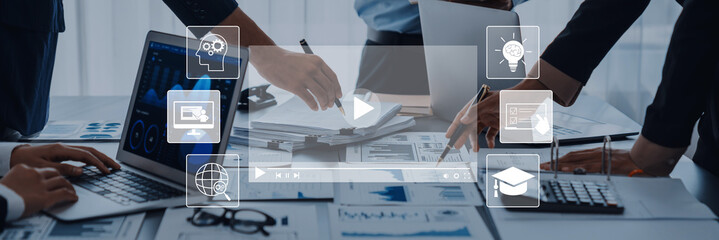 A dynamic office meeting showcasing teamwork and digital tools, with professionals engaging in strategy discussions and analyzing data for effective decision-making. Trope