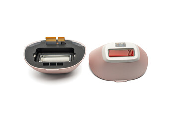 Two IPL treatment heads on white background, one opened to show internal lamp module. Concept image for spare parts, maintenance and repair.