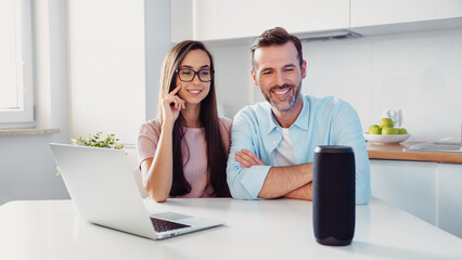 Couple using smart speaker, home assistant
