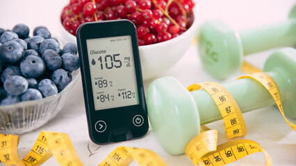 Diabetes diet, glucometer and vegetables on table