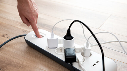 Power strip socket with connected plugs.