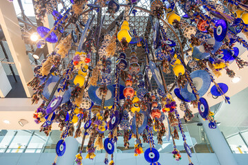 Decorative home decorations eye of Fatima pendants hang suspended from the ceiling.