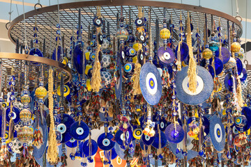 Decorative home decorations eye of Fatima pendants hang suspended from the ceiling.
