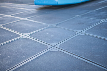 Tram train crossing tracks. Diffuse background of tracks and part of a tram in Gothenburg, Sweden. 