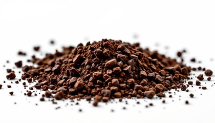 A close up view of a collection of cocoa powder particles spread out against a white background, showcasing their texture and uniformity.