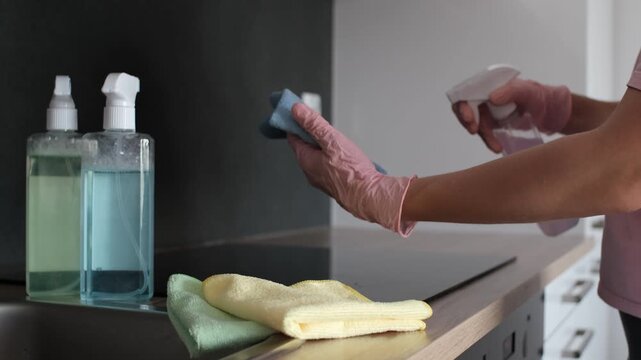 Close-up of cleaning spray on microfiber cloth