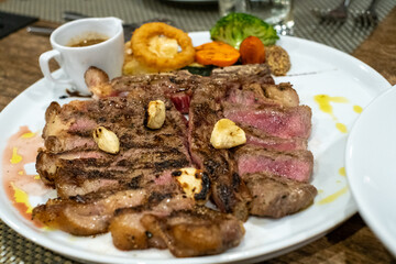 Juicy Grilled Steak Dinner with Vegetables and Sauce