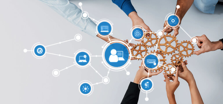 A dynamic image showcasing diverse hands collaborating over gears and digital icons, symbolizing teamwork and innovation in technology and communication strategies. Amity