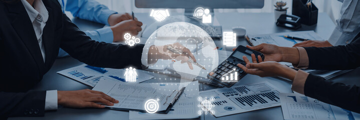 A dynamic business meeting scene showcasing collaboration with digital elements and financial tools, emphasizing teamwork in a modern office setting. Trope