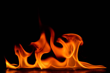 Dense clustered multiple peak flames with complex overlapping forms against black background,...