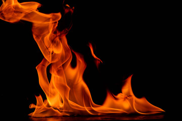 Central tall dominant flame flanked by smaller surrounding flames against black background, featuring intense orange and red coloring with powerful upward energy, capturing the majesty and commanding 