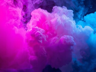 Fototapeta premium Vibrant pink and blue smoke clouds exploding in darkness