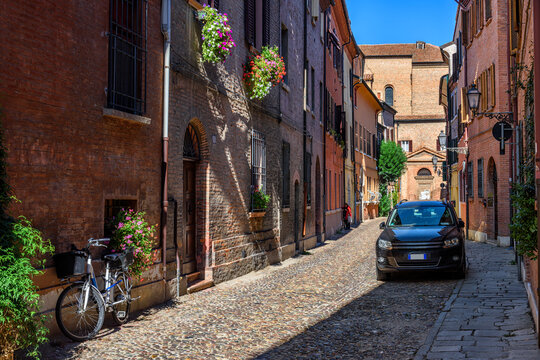 Fototapeta Cozy narrow street in Ferrara, Emilia-Romagna, Italy. Ferrara is capital of the Province of Ferrara