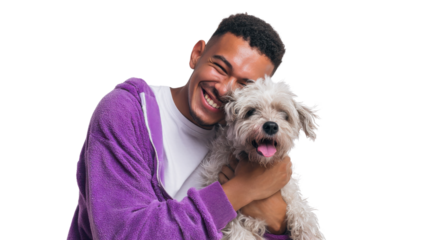 Joyful Companion: A smiling person embraces a fluffy dog, capturing a heartwarming moment of friendship and love. 