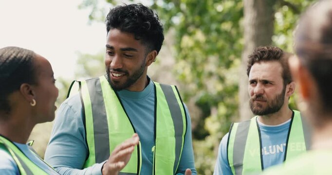 Charity, instructions and meeting with volunteer group outdoor for community service direction. Activism, collaboration and outreach with man speaking to ngo team in park for non profit organization