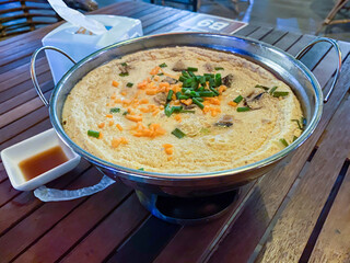 Delicious Traditional Dish Served in Circular Metal Bowl