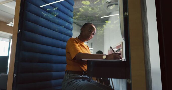 Woman, tablet and writing in office pod for article notes, editor feedback and story research. Journalist, black person and digital app in cubicle for proofreading draft, blog planning or hybrid work