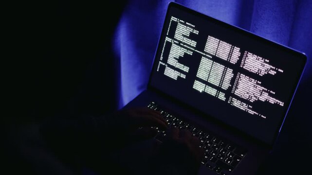 Computer maintenance in progress, System update and backup being performed, Methodical environment where technician is performing system updates and data backups using glowing keyboard and monitor