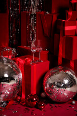 Luxury holiday decoration with red presents, silver tinsel and disco balls