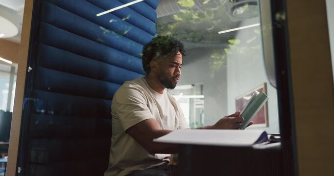 Man, research and tablet in office pod for creative project, editor feedback or article review. Hybrid work, journalist and thinking in cubicle for proofreading, publishing schedule or blog planning