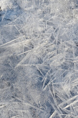 Delicate ice crystals form intricate patterns, a winter wonderland scene.