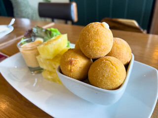 Appetizing Platter of Cheese Balls and Pineapple Slices