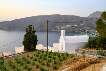 Potamos village overlooking Aegiali village and Aegean Sea. Amorgos, Cyclades, Greece
