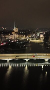 facing zurich night historic center university bridges lake waterfront highlight swiss banking capital backward drone view switzerland backward-facing eth 