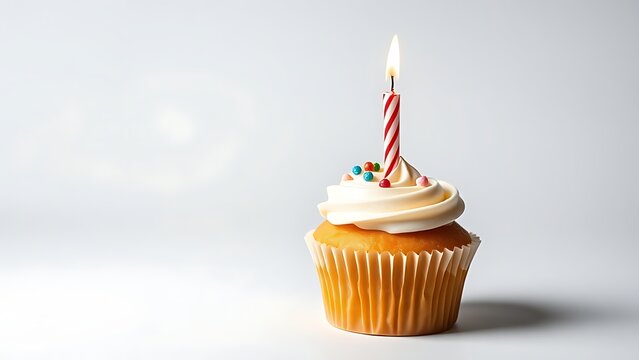 interlude. A single birthday cupcake with a lit candle on a festive table. symbolizing life milestones and joyful moments, menu design, designed for culinary blogs and recipe cards for restaurants.