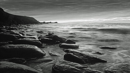 Black and white illustration of sea and rocks.  Woody Bay in the Exmoor National Park , Devon, England