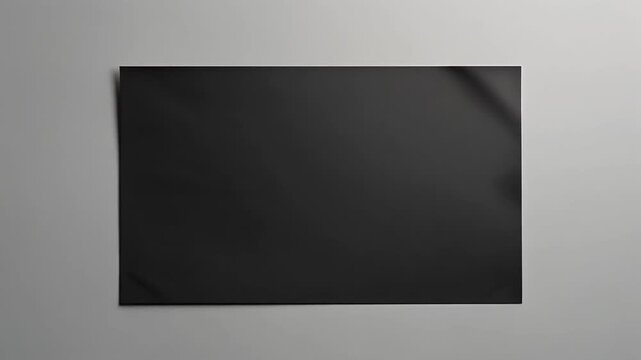 Dark reflective sheet against gray backdrop