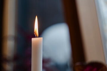 Candle light illuminating the darkness and bringing warmth to the setting.