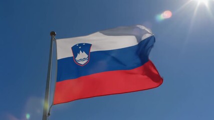 Slovenian flag waving proudly in the bright sunshine, representing national pride and patriotism in a vibrant display of color and movement