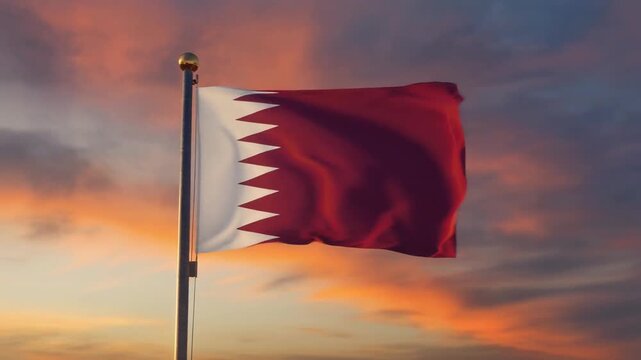 Qatar's flag waves proudly against a vibrant sunset backdrop, symbolizing national pride and unity under a colorful sky