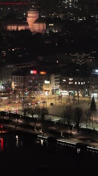 upwards zurich's town center night sechsel utenplatz eth zurich surrounding churches under dark skies aerial drone panning shot view university city switzerland nighttime 