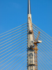 Construction of a large bridge. Cable stayed bridge in Belgrade, Serbia. Part of the Ada bridge beautiful sky with cloud background, Selective focus.