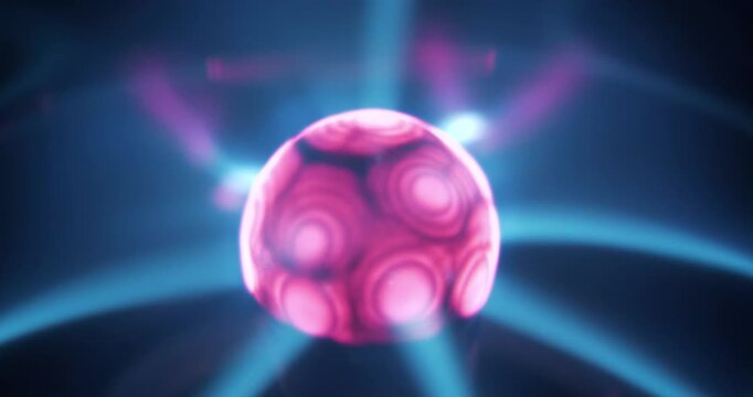 Plasma globe with noble gas inside and with filaments extending from inner sphere to outer. Electromagnetic interactions are responsible for glowing filaments. Also works as an ionizer