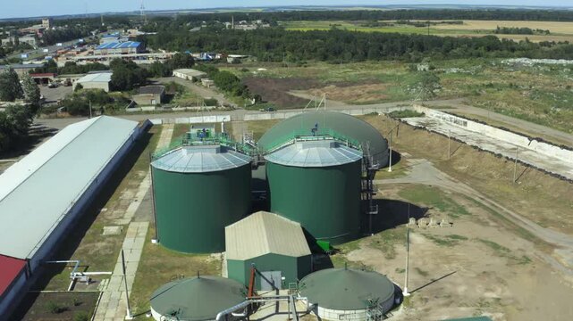 Aerial view of biogas plant with digesters and gas holders in operation