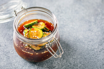 Korean trendy cucumber spiced salad in a bowl on the table