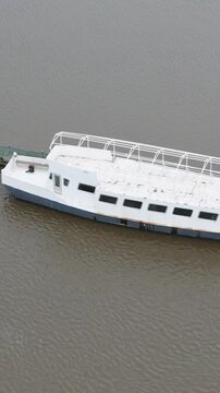 abandoned passenger river transport boat water dilapidated state vessel glimpse into region's maritime circling aerial shot temse belgium ship 