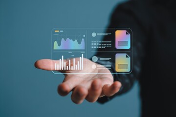 A person interacting with a futuristic virtual user interface displaying business analytics and financial data