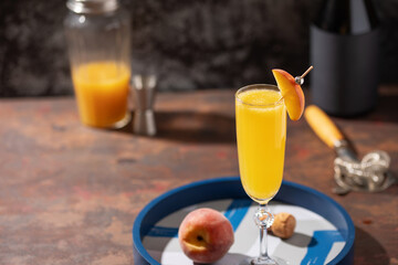 Summer alcohol drink peach bellini or mimosa in flute glasses. Brunch cocktail