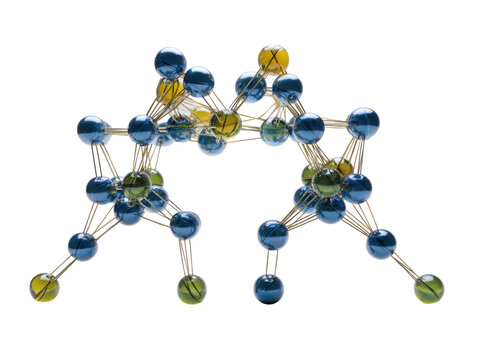 A blue and green ball structure with a yellow ball in the middle