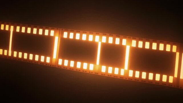 Glowing celluloid film strip illuminates darkness