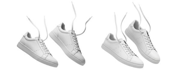 Set of white leather sneakers with untied shoelaces floating in the air isolated on white