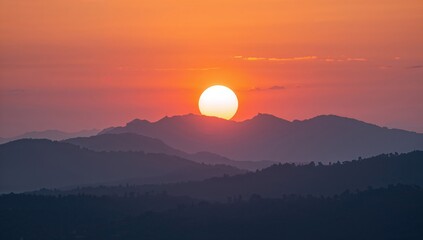 Rising sun illuminating the mountain landscape, seasonal change