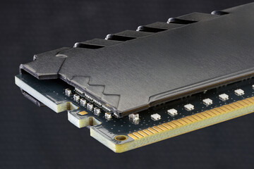 Close-Up Of A Computer RAM Module With Heat Spreader In Dark Background