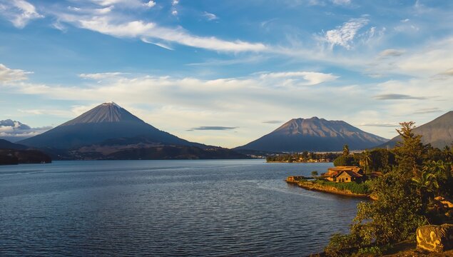 Lake Atitlan surrounded by highland volcanos, showcasing natural beauty and seasonal change