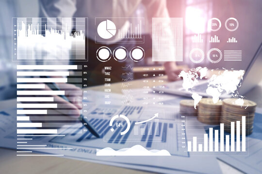 A professional workspace featuring financial documents and advanced data visualizations. This image showcases analytics tools for business growth and strategy. Impute